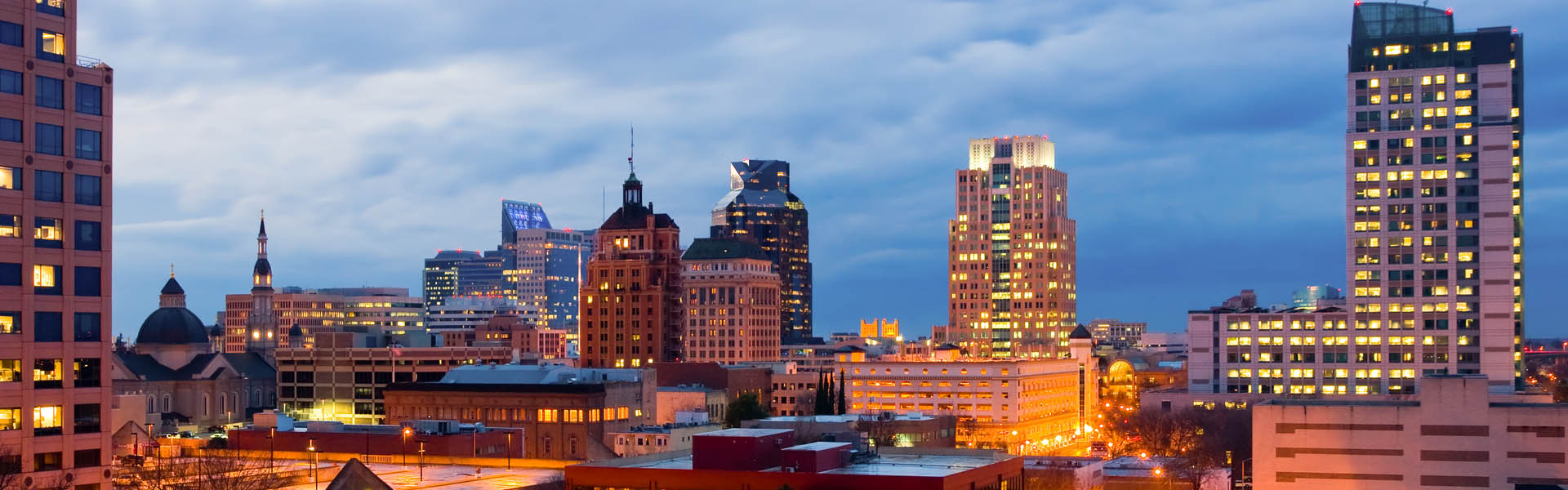 Neon color image of a band playing and people singing along