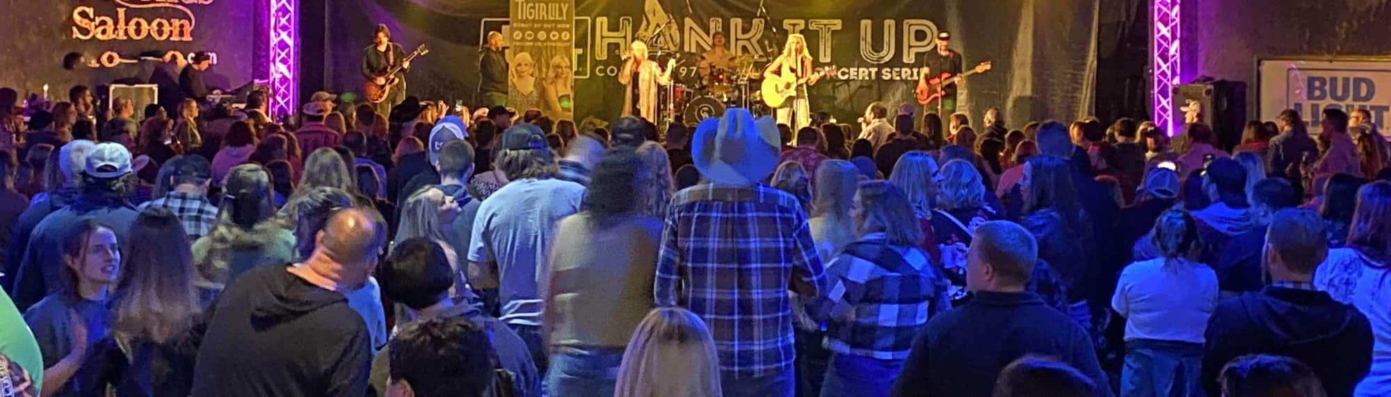 country concert with fans wearing cowboy hats Sacramento